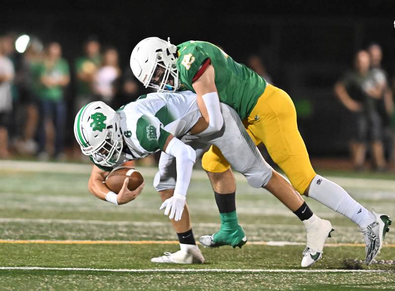 Providence Catholic's defender sacks Niles Notre Dame's Luke Dickey during  a conference game on Friday, Sep 20, 2024 at New Lenox. (Dean Reid for Shaw Local News)