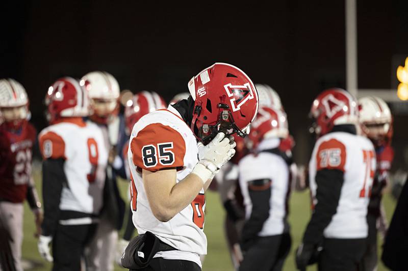 Amboy’s Brennan Blaine walks off the field after a tough 44-36 loss to West Central in the 8-man championship game Friday, Nov. 18, 2022.