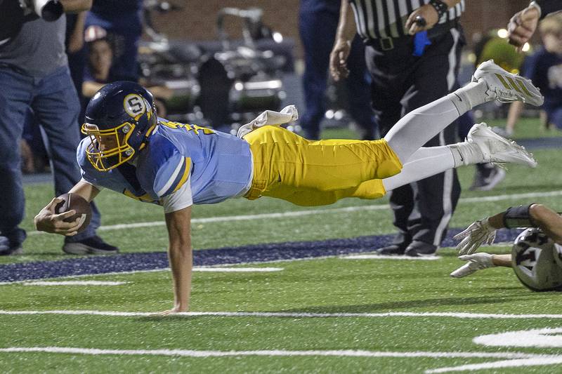 Sterling’s Brady Berlin dives for yards against Moline Friday, Sept. 12, 2025.