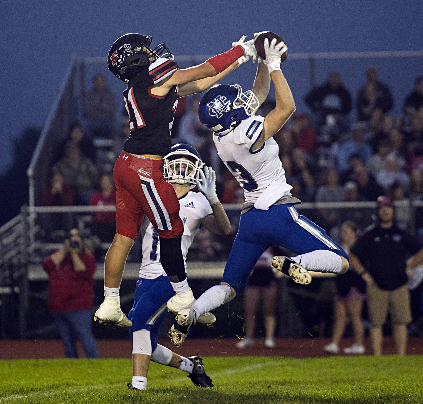 Newman’s Mac Hanrahan hauls in an interception in front of Erie-Prophetstown’s Parker Rangel Friday, Sept. 22, 2023 in a game at Erie.