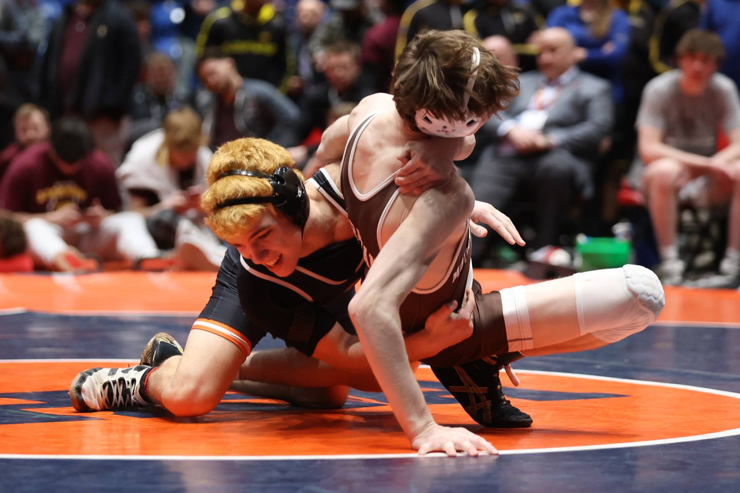 DeKalb’s Danny Curran throws Mount Carmel’s Eddie Enright to the mat in the Class 3A 132 pound dual team championship match at Grossinger Motor Arena in Bloomington. Saturday, Feb. 26, 2022, in Champaign.