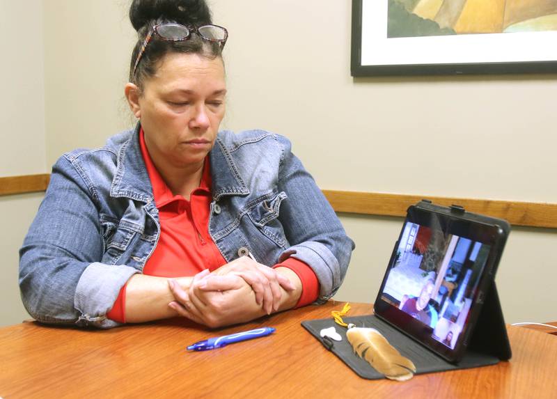 DeKalb County Board member Terri Mann-Lamb, part of the Ramapough Lenape Nation, a band of the Munsee people who originally settled in New Jersey thousands of years ago,
 listens to her brother, Ramapough Lenape Nation Turtle Clan Chief Vincent Mann, talk via Zoom call Tuesday, Oct. 26, 2021, about issues facing Native Americans today.