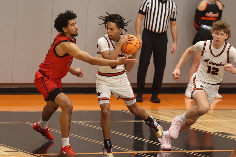 Minooka’s Jordan Freeman secures the rebound against Bolingbrook on Tuesday, Dec. 17, 2024 in Minooka.