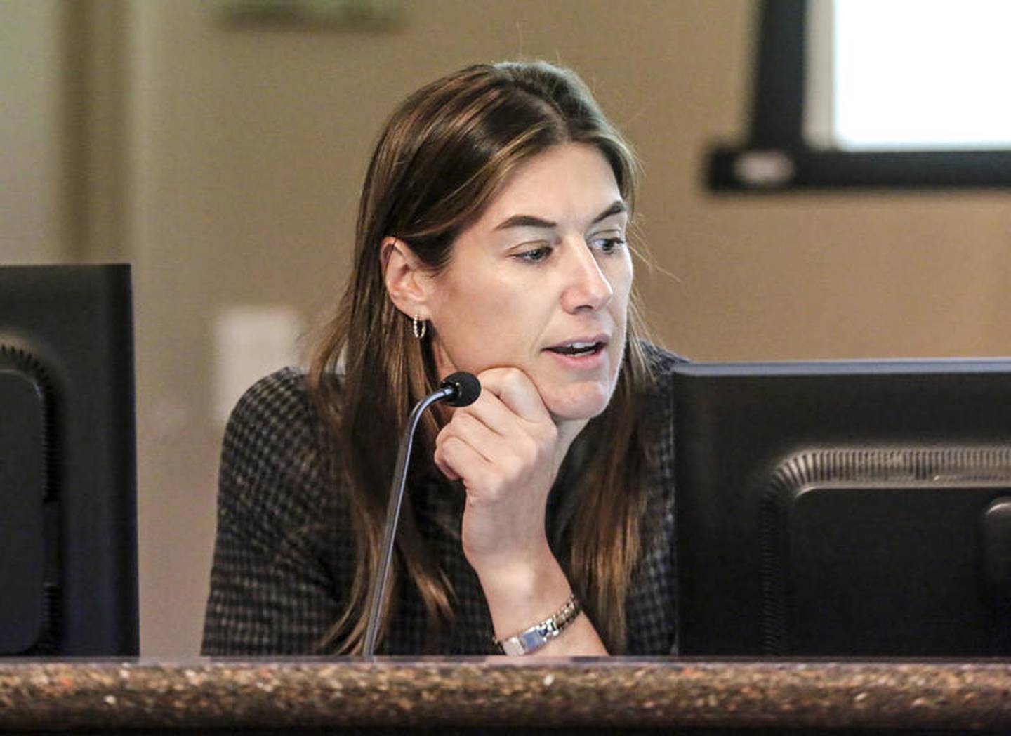 Public Utilities Director Allison Swisher reads from a presentation during an environmental commission meeting Tuesday, Dec. 10, 2019, at Joliet City Hall in Joliet, Ill.