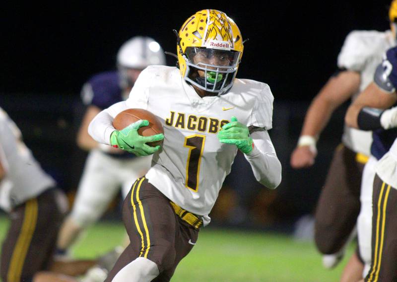 Jacobs’ T.O. Boddie runs the ball in varsity football on Friday, Sept. 20, 2024, at Al Bohrer Field on the campus of Cary-Grove High School in Cary.