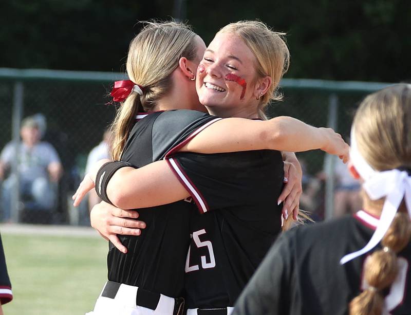 Antioch's Claire Schuyler (left) and Jacey Schuler hug after their Class 3A supersectional win Monday, June 3, 2024, over Sycamore at Kaneland High School in Maple Park.