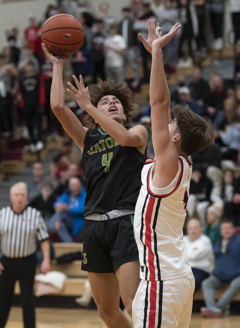 Crystal Lake South's Anthony Demirov shoots over Huntley's Ian Ravagnie during their game on Friday, December 16, 2022 at Huntley High School. Ryan Rayburn for Shaw Local
