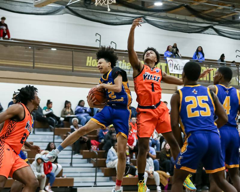 Joliet Central's Zion Kostyra (2) grabs a rebound in the WJOL Tournament Championship game. Nov 25, 2023.