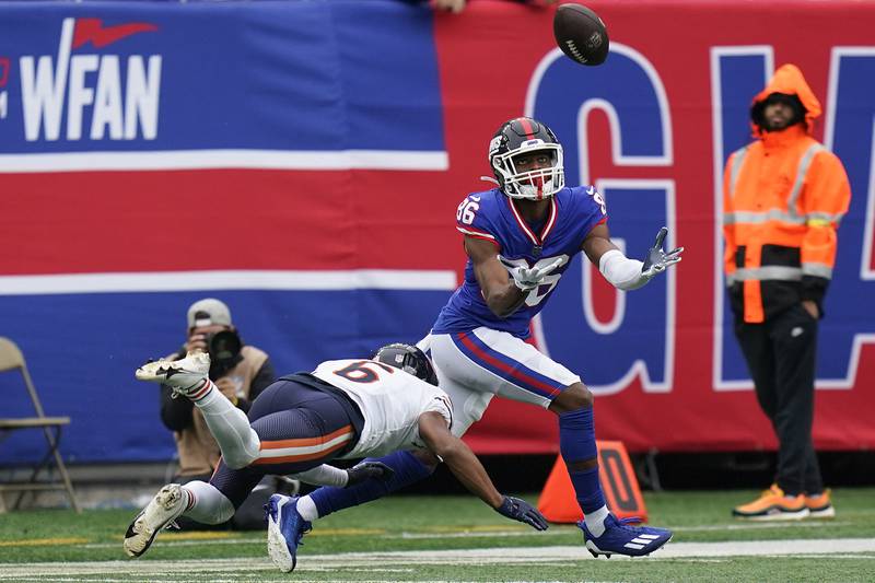 New York Giants wide receiver Darius Slayton (86) can't come up with a catch while defended by Chicago Bears cornerback Kyler Gordon (6) during the third quarter of an NFL football game, Sunday, Oct. 2, 2022, in East Rutherford, N.J. (AP Photo/Seth Wenig)