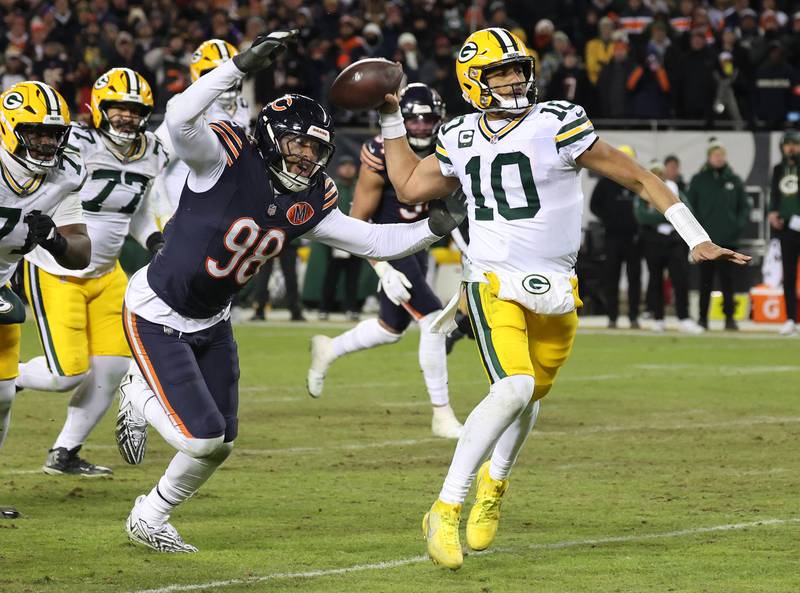 Chicago Bears defensive end Montez Sweat hits Green Bay Packers quarterback Jordan Love as he throws during the Packers last drive in the Bears NFL Wild Card game win Saturday, Jan. 10, 2026, at Soldier Field in Chicago.