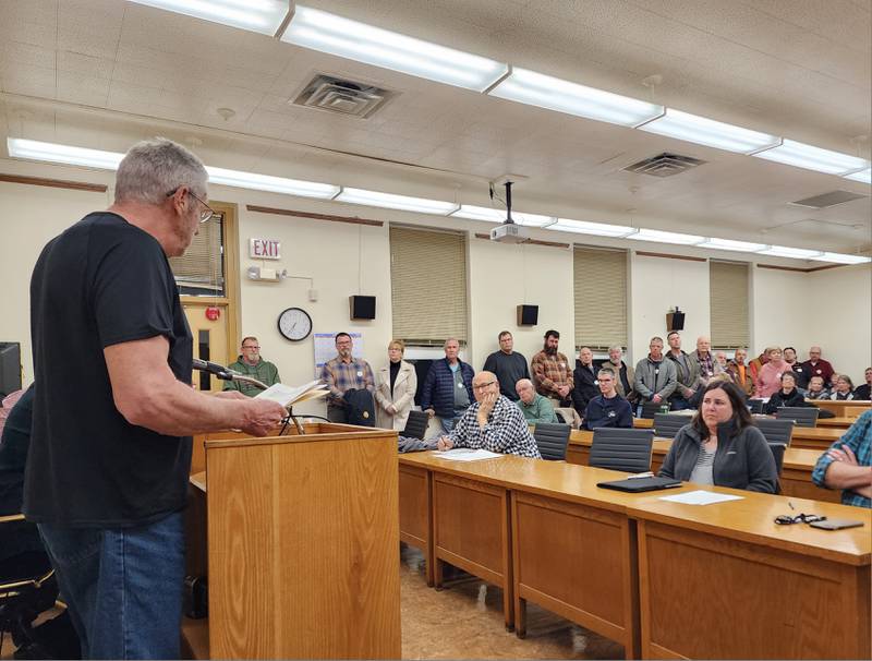 Visitors and Bureau County Board listen as Resident Dave White speaks during public comment in favor of adopting a resolution denouncing the state's assault weapons ban on Tuesday, Feb. 14, 2023.