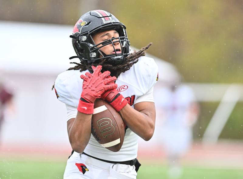 Metamora's Charlie Delinski (9) holds on to a deep pass during the class 4A second round playoff game against Morris on Saturday, NOV. 08, 2025, at Morris.