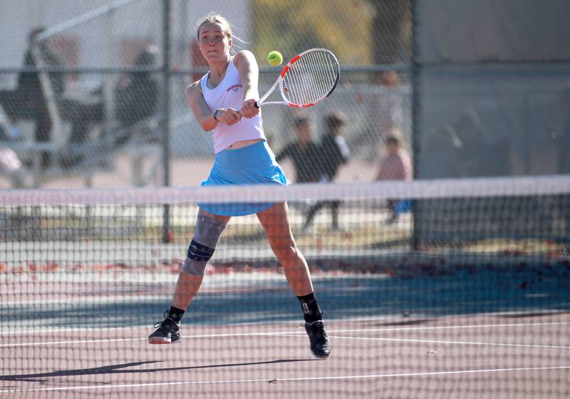Julia Lukey of Marian Central returns the ball during a doubles match with partner Jenna Remke (not pictured) Thursday, Oct. 24, 2024 in the IHSA 1A doubles tennis championship at Palatine High School.