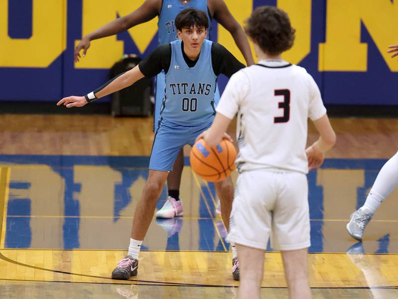 IMSA’s Neil Sitapara plays defense against Indian Creek's Logan Schrader Friday, Feb. 6, 2026, during their Little 10 Conference championship game at Somonauk High School.