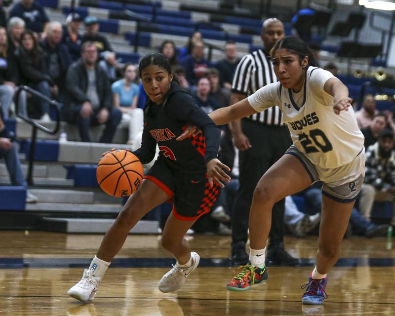 Minooka's Kendall Thomas (3) drives past Oswego East's Jaliyah Shepard (20) on the way to the basket during their basketball game between Minooka at Oswego East Friday, Jan 16, 2026 in Oswego.