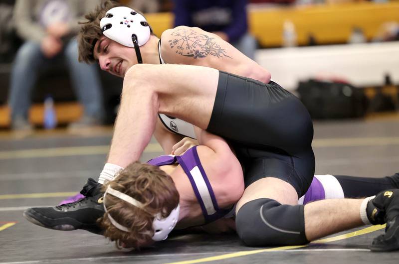 Kaneland’s Caden Grabowski controls Rochelle’s Frank Nasca in their 132 pound match Saturday Jan. 21, 2023, during the Interstate 8 Conference wrestling tournament at Sycamore High School.