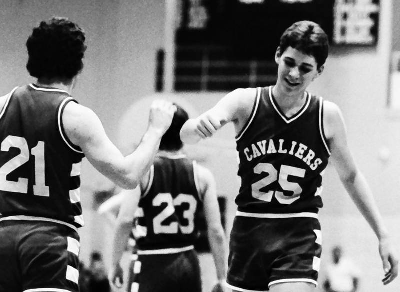 L-P's Mark Anglavar hi-fives teammate Tom Happ during the Regional title game on Saturday, Feb. 28, 1986 at La Salle-Peru Township High School.