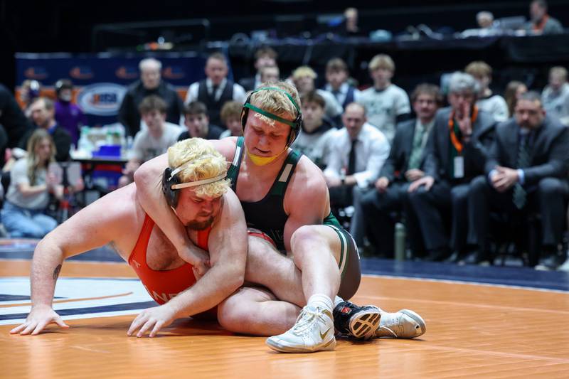 Coal City's Cade Poyner, right, wrestles Vandalia's Dominic Swyers in the 285-pound match during the Coalers' IHSA Class 1A Dual Team State championship victory over Vandalia on Saturday, Feb. 28, 2026.