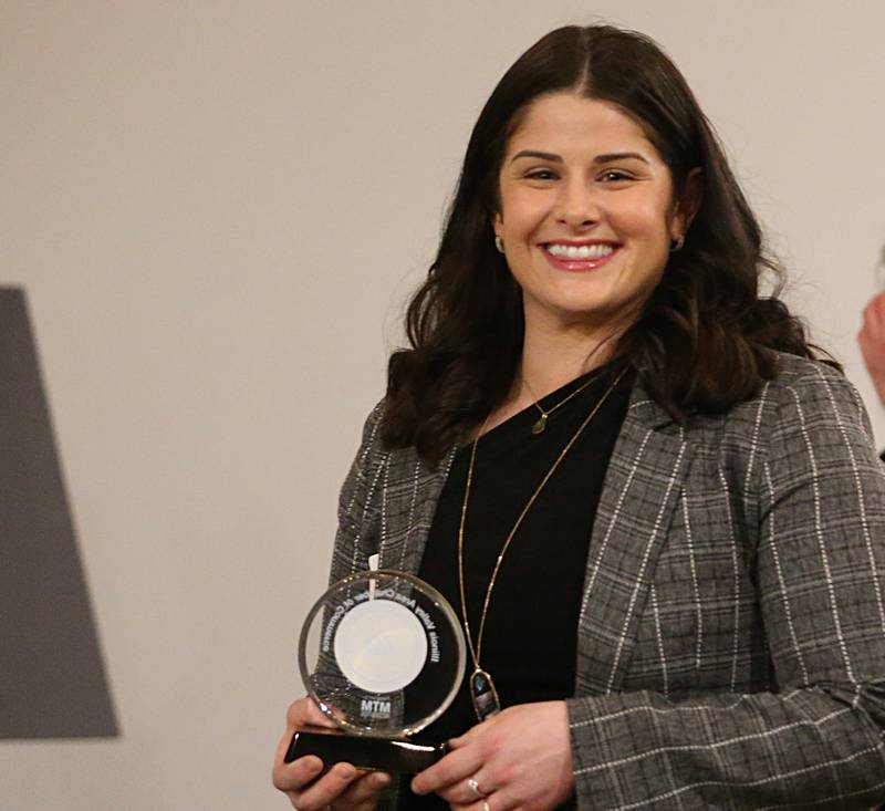 Maryjean Orozco, Owner, Sure Step IL poses for a photo with her award during the Illinois Valley Chamber of Commerce 40 Under Forty Awards Gala on Thursday, Feb. 9, 2023 at Westclox in Peru.