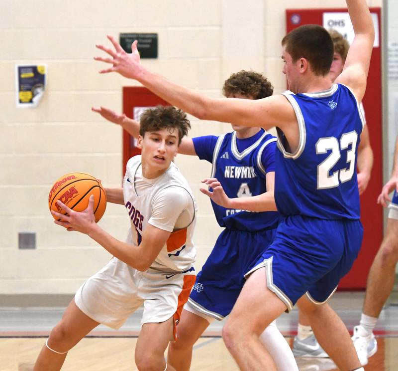Genoa-Kingston's Benjamin Kleba looks to pass against Sterling Newman's Easton Coward (4) and John Rowzee (23) at the Oregon Boys Basketball Thanksgiving Tournament on Wednesday, Nov. 26, 2025 at Oregon High School.