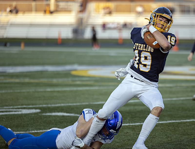 Sterling’s Mason Emin fights for yards against St. Francis Saturday, Nov. 4, 2023 in a class 5A playoff game in Sterling.