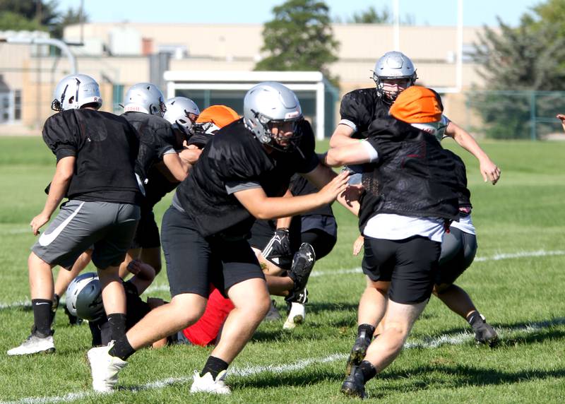 The Kaneland High School football team practices in Maple Park on Wednesday, Aug. 10, 2022.