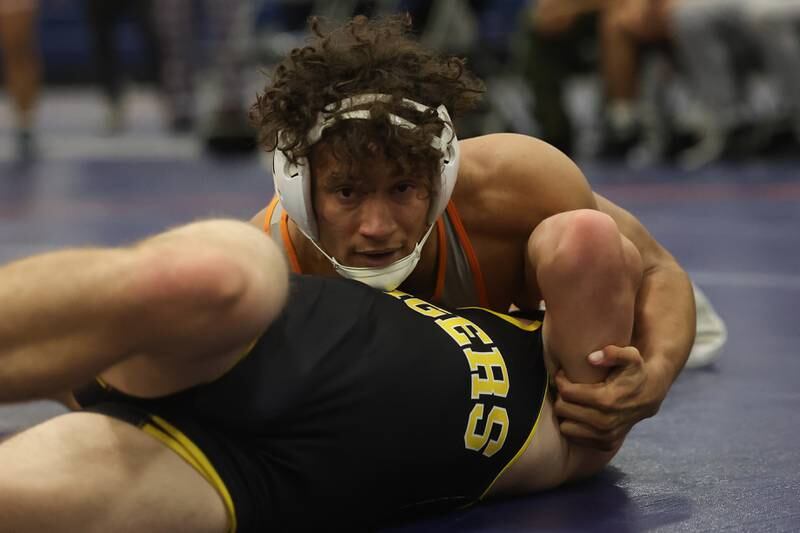 Romeoville’s Mason Gougis looks to pin Joliet West’s Korey Koser in a dual meet on Thursday, Dec.14th, 2023 in Romeoville.