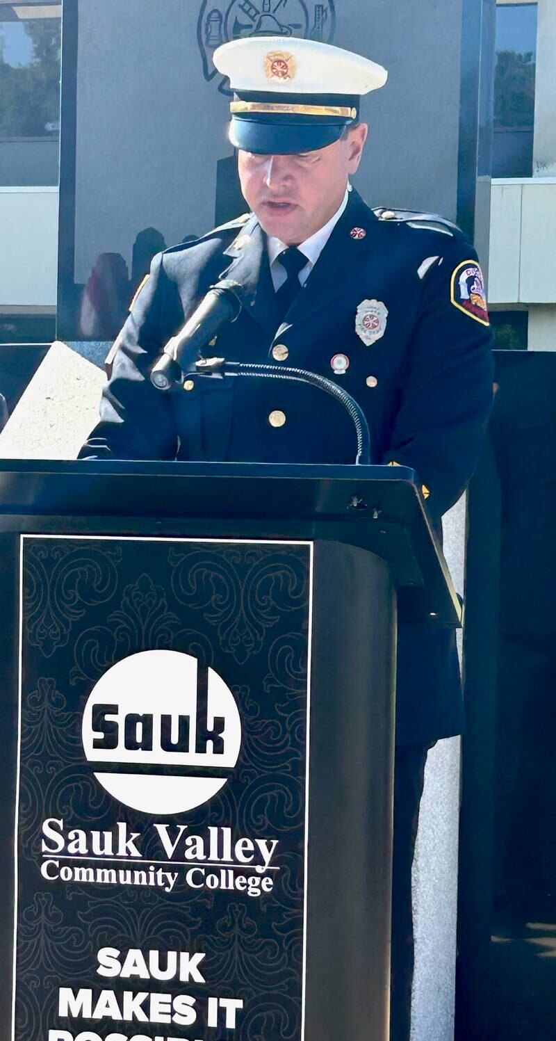 Dixon Fire Chief Ryan Buskohl reads a passage Saturday during a Sept. 11 remembrance ceremony at Sauk Valley Community College.