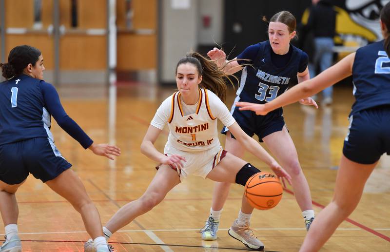 Montini’s Nikki Kerstein is surrounded by Nazareth defenders Allia Von Schlegell (1), Molly Moore (33), and  Samantha Austin during a Coach Kipp Hoopsfest game on January 20, 2025 at Benet Academy in Lisle.