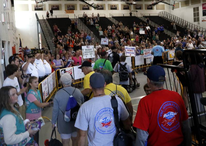 McHenry County Honor Flight veterans enter the gym at McHenry Community High School’s Upper Campus for a homecoming celebration on Sunday, Aug. 27, 2023, after their trip to Washington D.C.