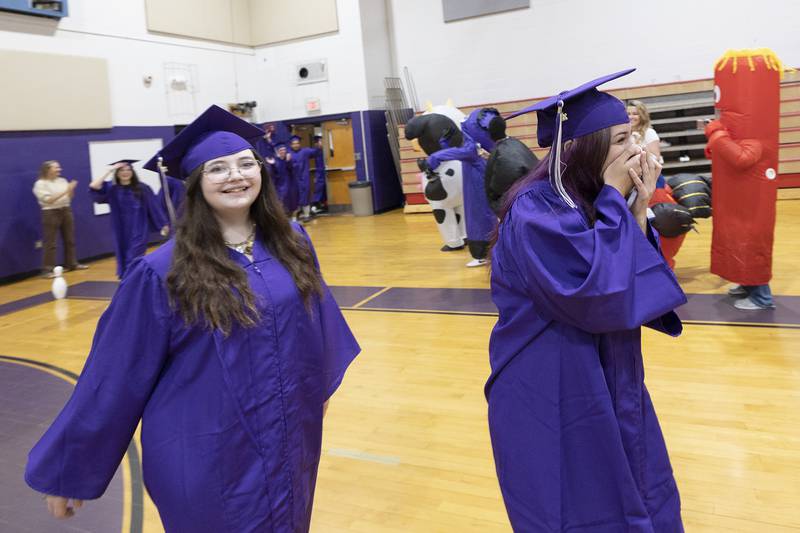 Graduating seniors react to seeing the inflatable display Wednesday, May 21, 2025.