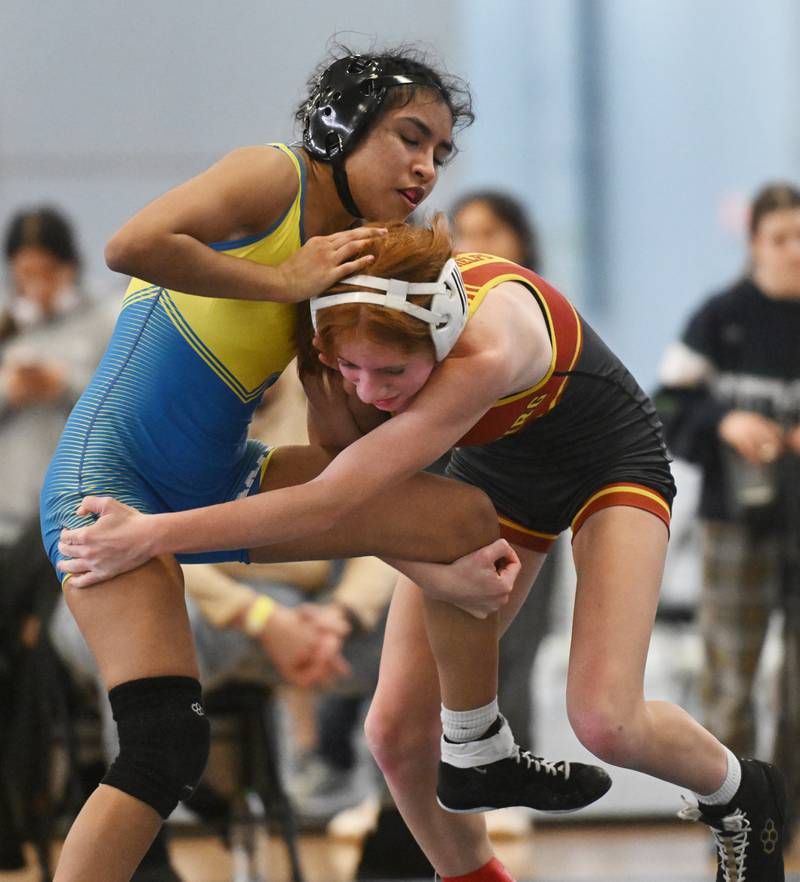 Wheaton North’s Isabelle Paz, left, wrestles Schaumburg’s Mia Phelps in the 100-pound championship match of the Willowbrook girls wrestling regional on Saturday, Feb. 1, 2025 in Villa Park.