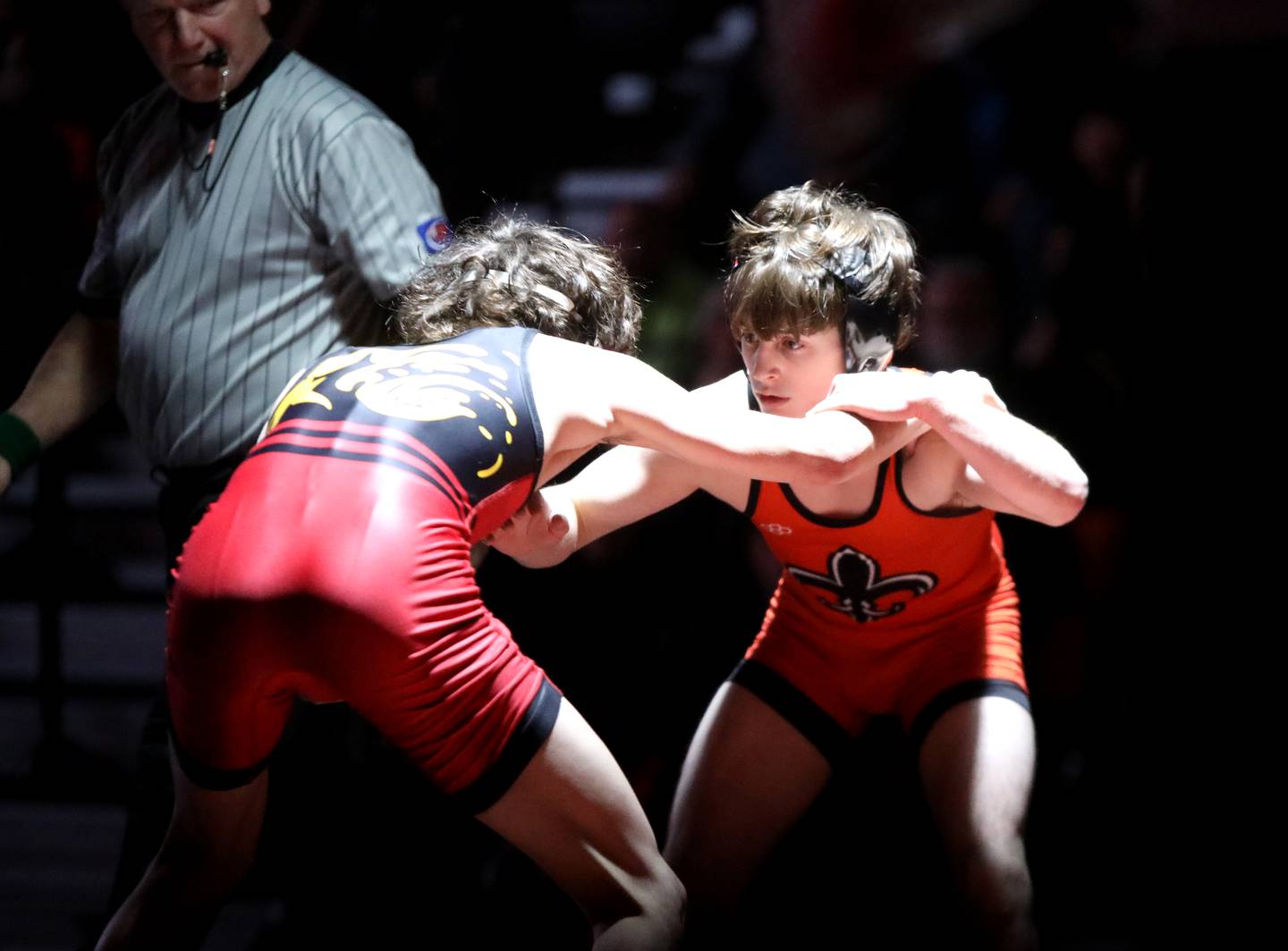 St. Charles East’s Dom Munaretto (right) wrestles Batavia’s Ino Garcia in the 120-pound weight class during a dual meet in St. Charles on Thursday, Jan. 4, 2024.