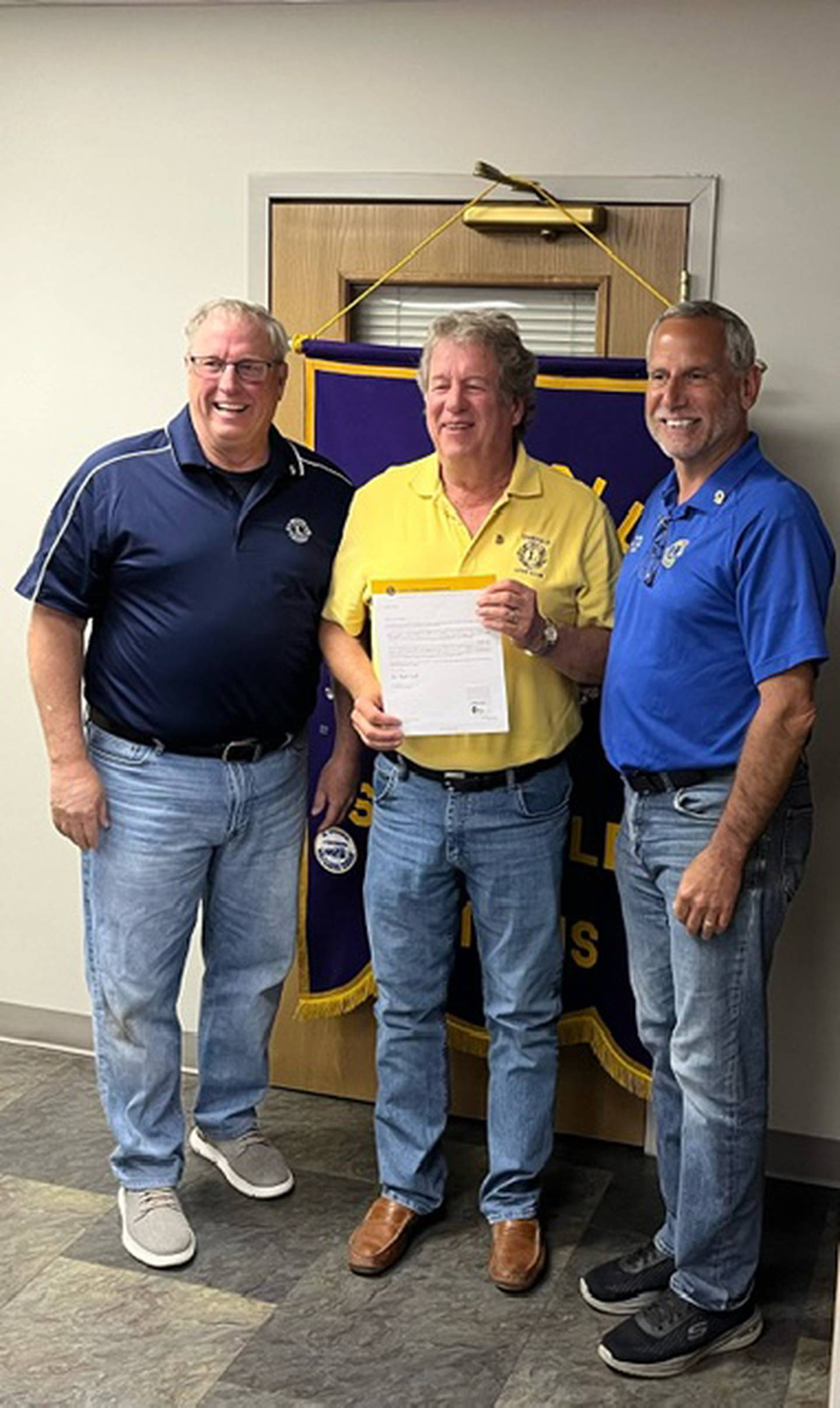 John Winger (middle) receives his Sheffield Lions Club 45-year chevron from Al Corwin (left) and Tom Drez