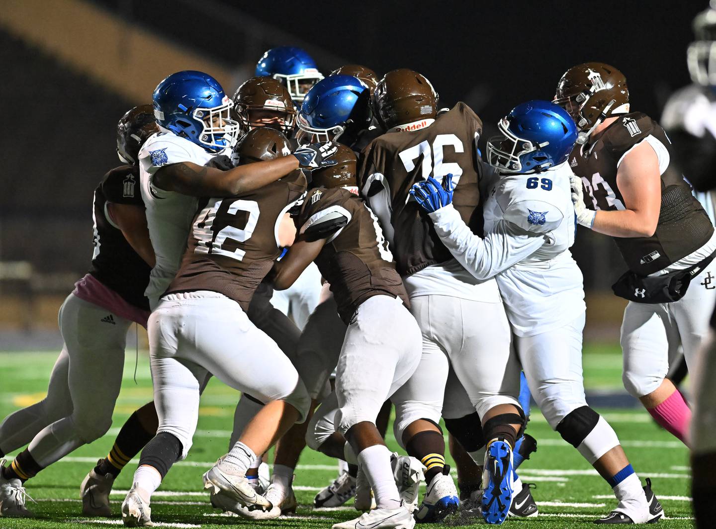 Joliet Catholic's defenders gang tackle the running back during IHSA Class 4A first round playoff on Friday, Oct. 28, 2022, at Joliet. (Dean Reid for Shaw Media)
