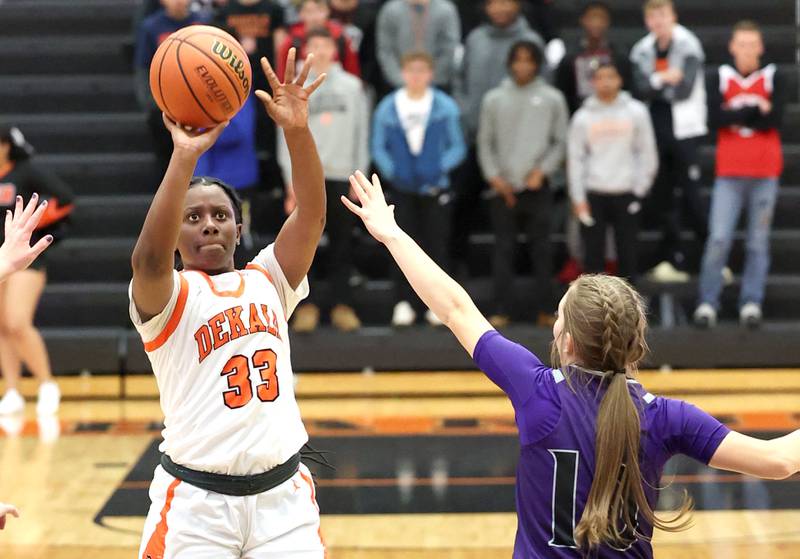 DeKalb's Cayla Evans shoots over Rochelle's Torrin Nantz during their game Monday, Nov. 28, 2022, at DeKalb High School.