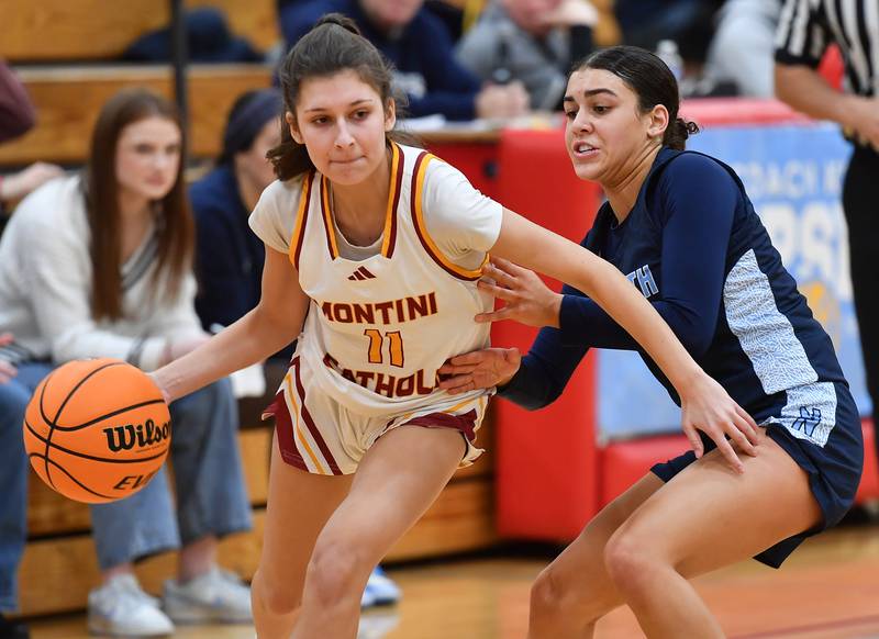 Montini’s Brooke Damico (11) drives as Nazareth’s Allia Von Schlegell defends during a Coach Kipp Hoopsfest game on January 20, 2025 at Benet Academy in Lisle.