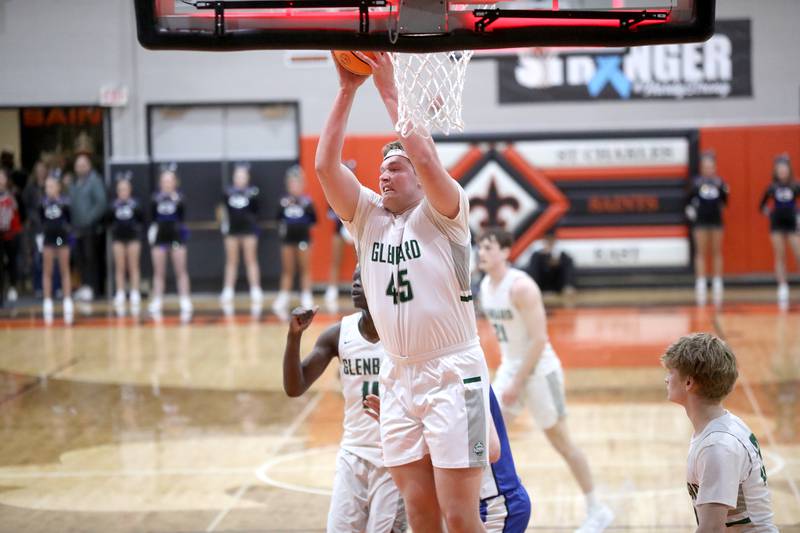 Glenbard West's Mike O'Connell pulls down a rebound during the Class 4A St. Charles East Sectional final against Geneva on Friday, March 7, 2025 in St. Charles.