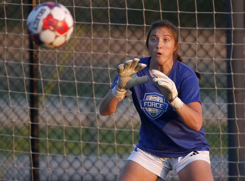 Crystal Lake Force goalkeeper Addison Cleary prepares to block a shot on goal during practice with the new semi-pro women's soccer team on Friday, May 23, 2025, at the MAC sports center in Crystal Lake. The Force is playing in the United Women’s Soccer league and his its first game on Saturday against Edgewater Castle Football Club.