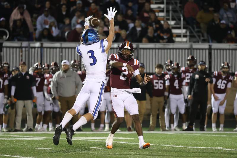 Brother Rice's C.J. Gray has his pass deflected by St. Charles North's Dan Escaro in the third round of the playoffs on Saturday, Nov. 15, 2025 in Chicago.