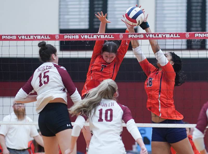 Oswego’s Kelsey Foster (7) and Maya Norlin (18) block a kill attempt by Plainfield North's Jade Wortman (15) during the class 4A Plainfield North regional volleyball final at Plainfield North High School on Thursday, Oct. 26, 2023.