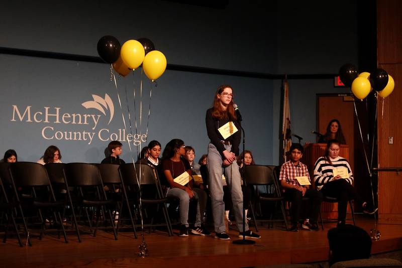 Abigail Huff of SS Peter and Paul spells a word during the McHenry County Regional Office of Education 2023 Spelling Bee Wednesday, March 22, 2023, at McHenry County College's Luecht Auditorium in Crystal Lake.