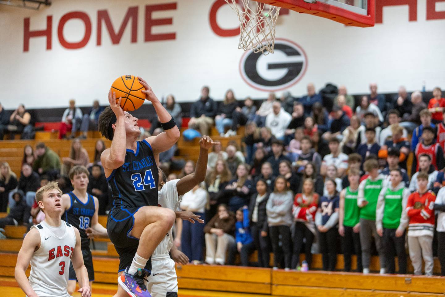 St. Charles North's Besnik Memedowski goes in for the layup against Glenbard East on Tuesday Dec.2,2025 in Lombard.