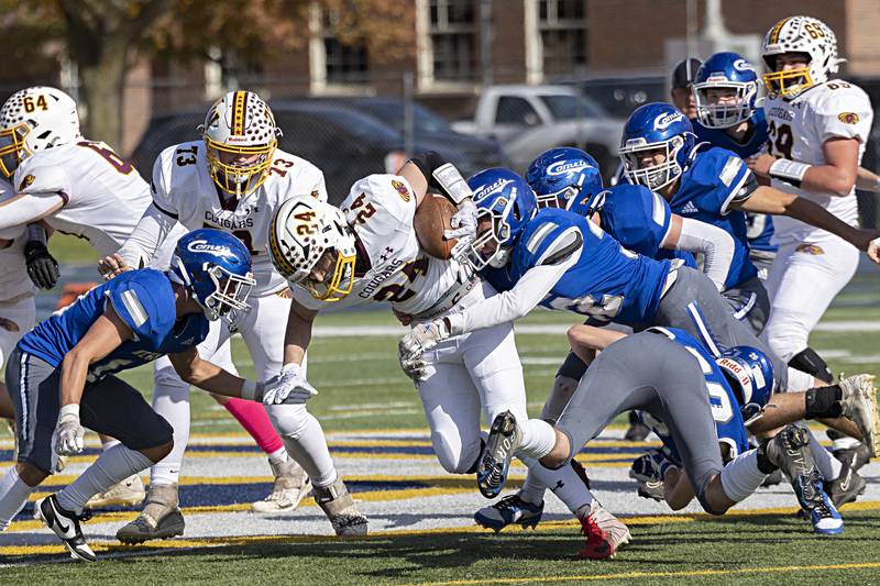 ROWVA’s Bryan Bertishofer runs for yards up the middle against Newman Saturday, Oct. 28, 2023 in the Class 1A playoffs in Sterling.