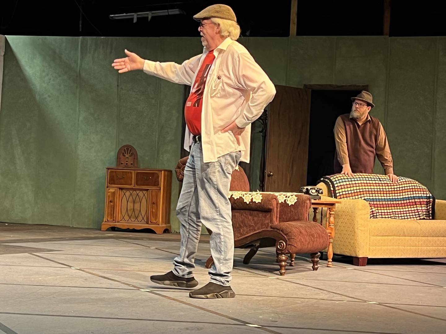 The director of Stage Coach Players rendition of "A Christmas Story," Stewart Ogilvie discusses prop placement for the show's set on Dec. 1, 2022.