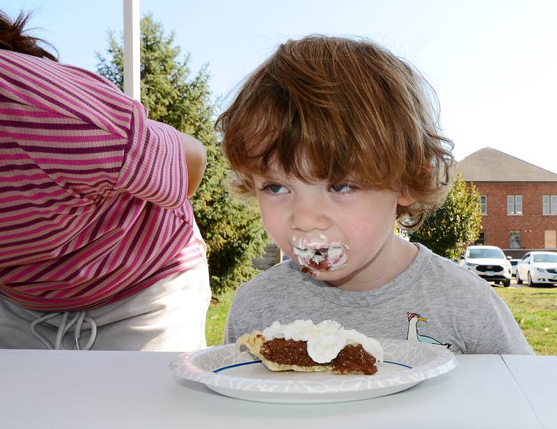 Macklin Blair comes up for air while competing in the pie eating contest Saturday during the annual Scarecrow Festival in Ottawa.