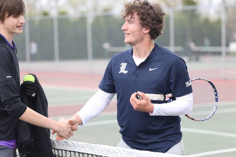 Lemont’s Ethan Bator congratulates Hononegah’s Braden Monson after finishing second at the Steelmen Invite on Saturday, April 20, 2024, in Joliet.