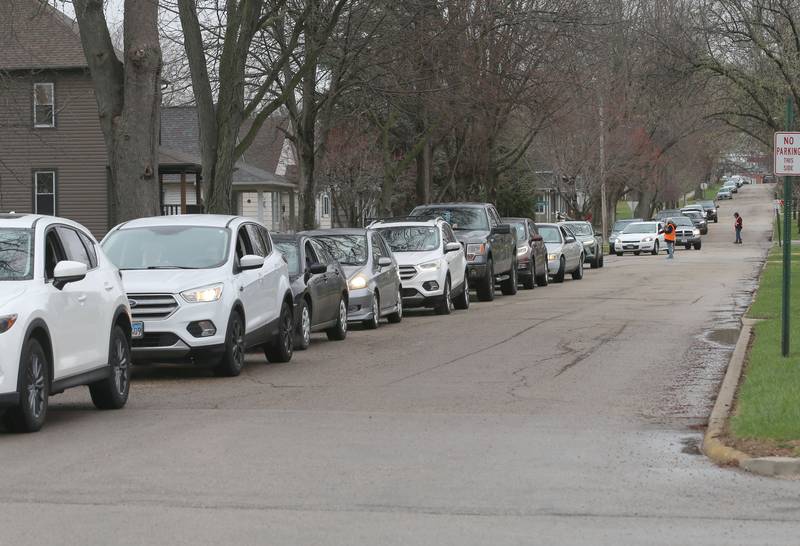 Cars stretch over 4 blocks as they wait in line for the annual Easter distribution on Wednesday, April 1, 2026 at the Hall Township Food Pantry in Spring Valley.
