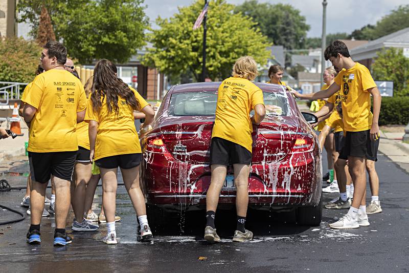 Building Lasting Impressions that Never Die (BLIND) leaders from five local high school Erie-Prophetstown, Newman, Morrison, Fulton and Rock Falls took part Friday, August 4, 2023 in several activities in Sterling as part of Hot Dog Days. One group washed cars in the lot behind city hall.