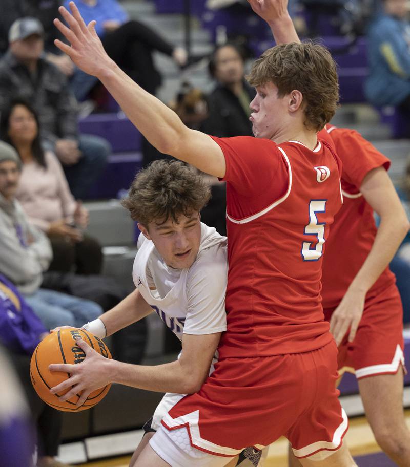 Dixon’s Brody Nicklaus looks to make a play while being guarded by Oregon’s Tucker O’Brien Tuesday, Feb. 3, 2026.